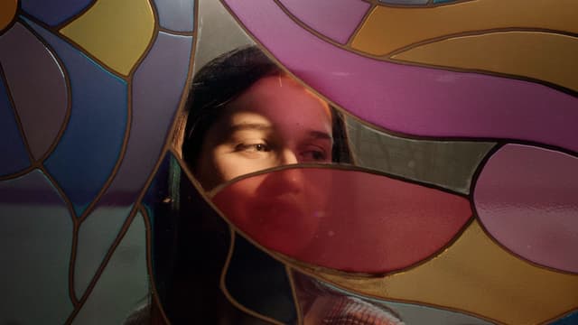 Cracks run through this multicolored glass